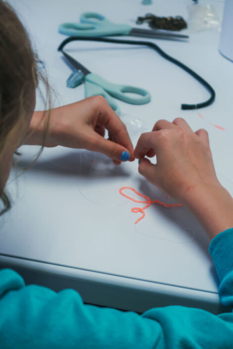 Beading at Culture Camp.